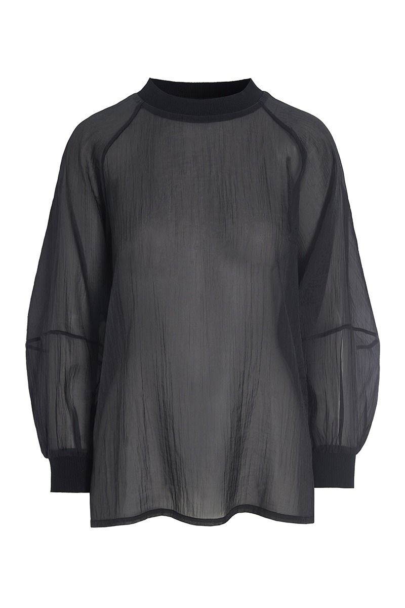 Black sheer blouse with long sleeves on a white background